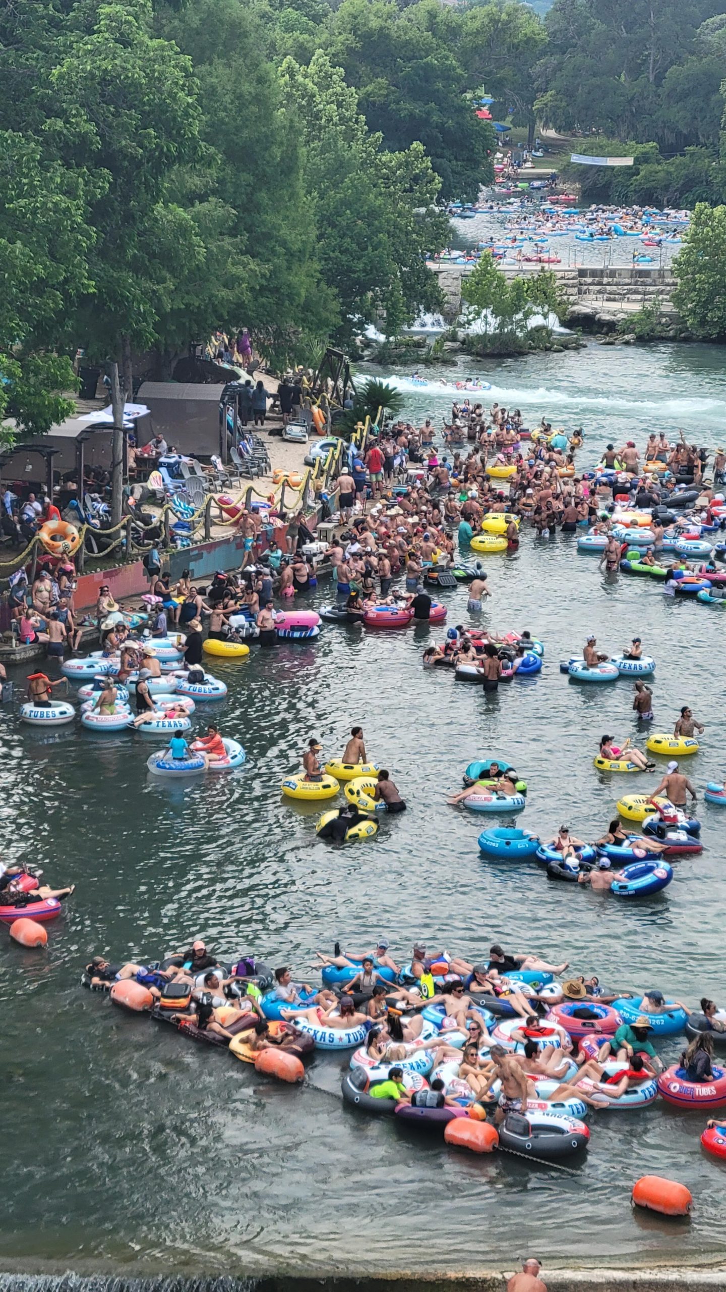 People having a great time floating the Comal River